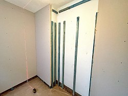 PIR insulated plasterboards installed internally to x3 external walls in the rear bedroom of this Victorian terrace house.